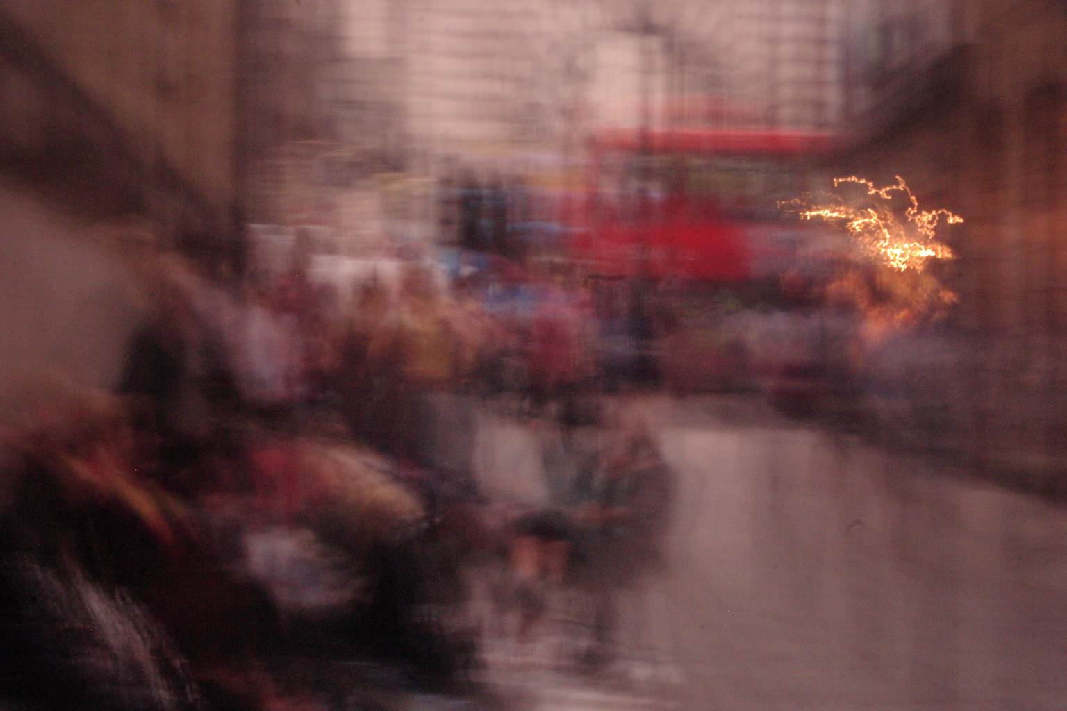 People queueing up for the Harry Potter book launch in London. Taken with purposeful camera shake to try and get the spark effect in the right hand side of the photo!