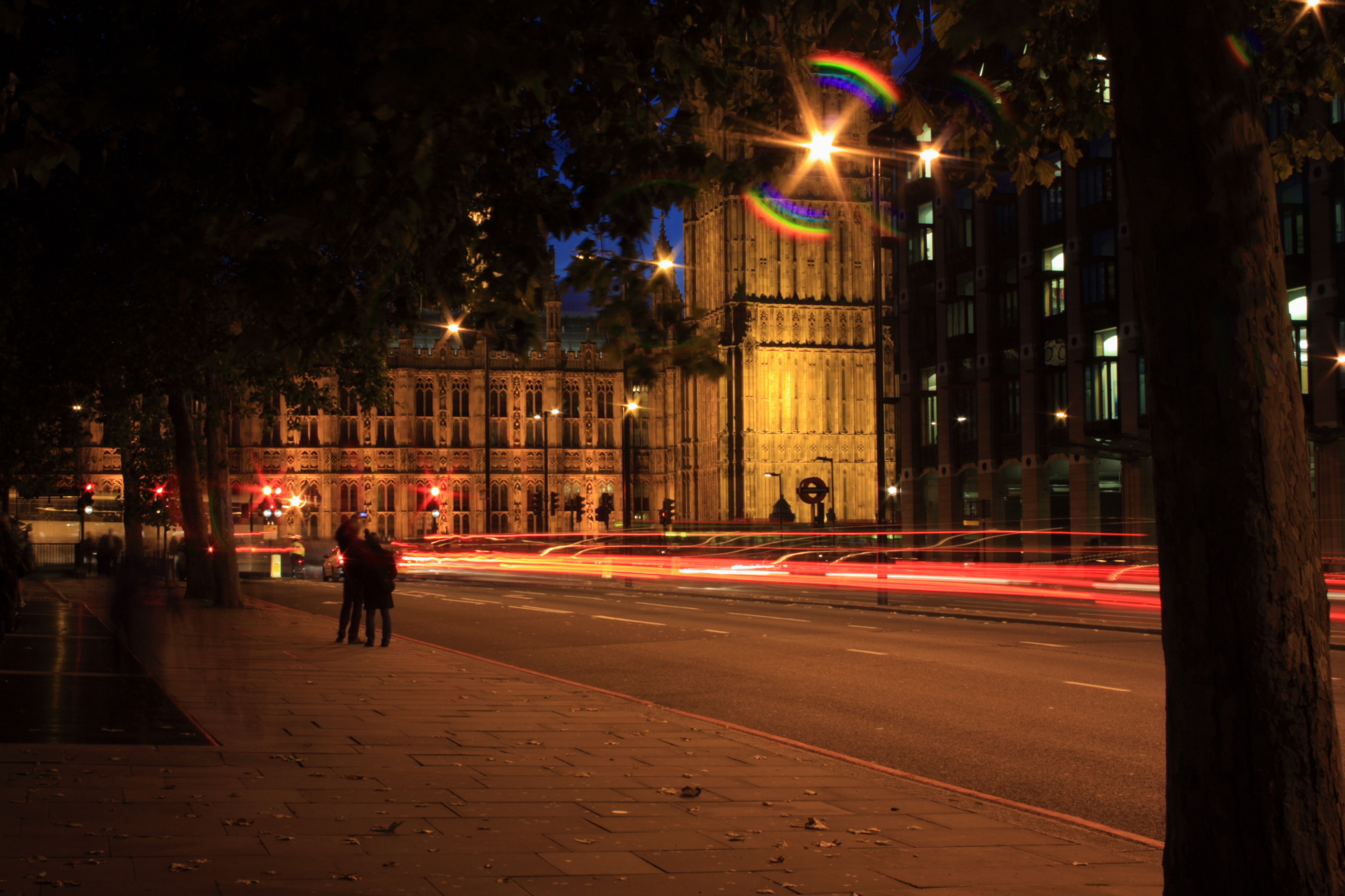 Traffic trails and ghosts near Houses of Parliament.