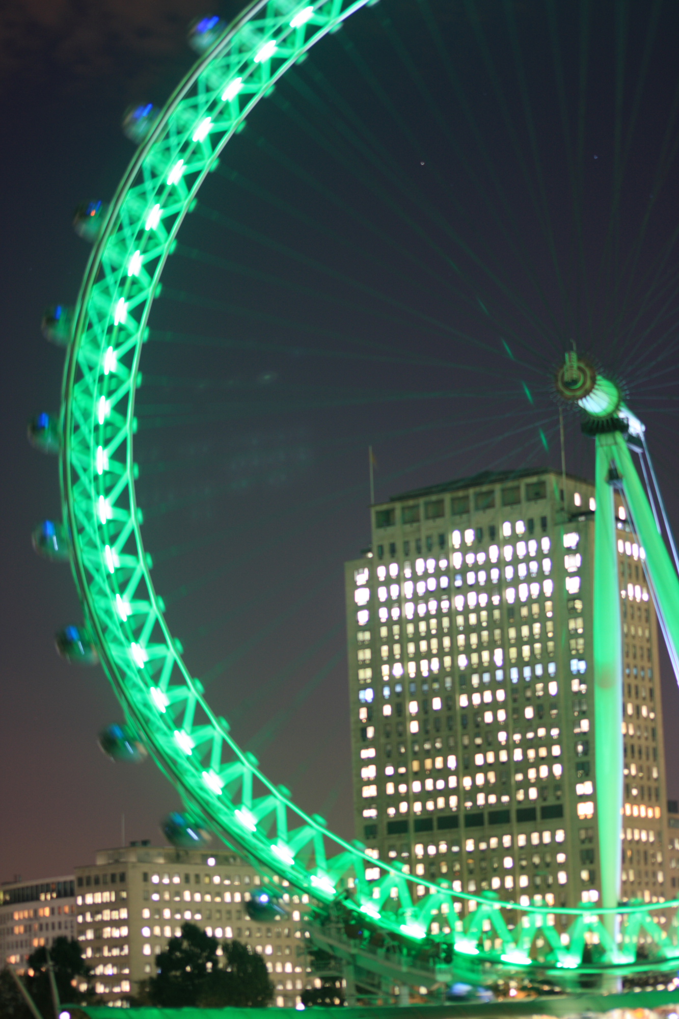 London Eye blurred and illuminated at night as it spins