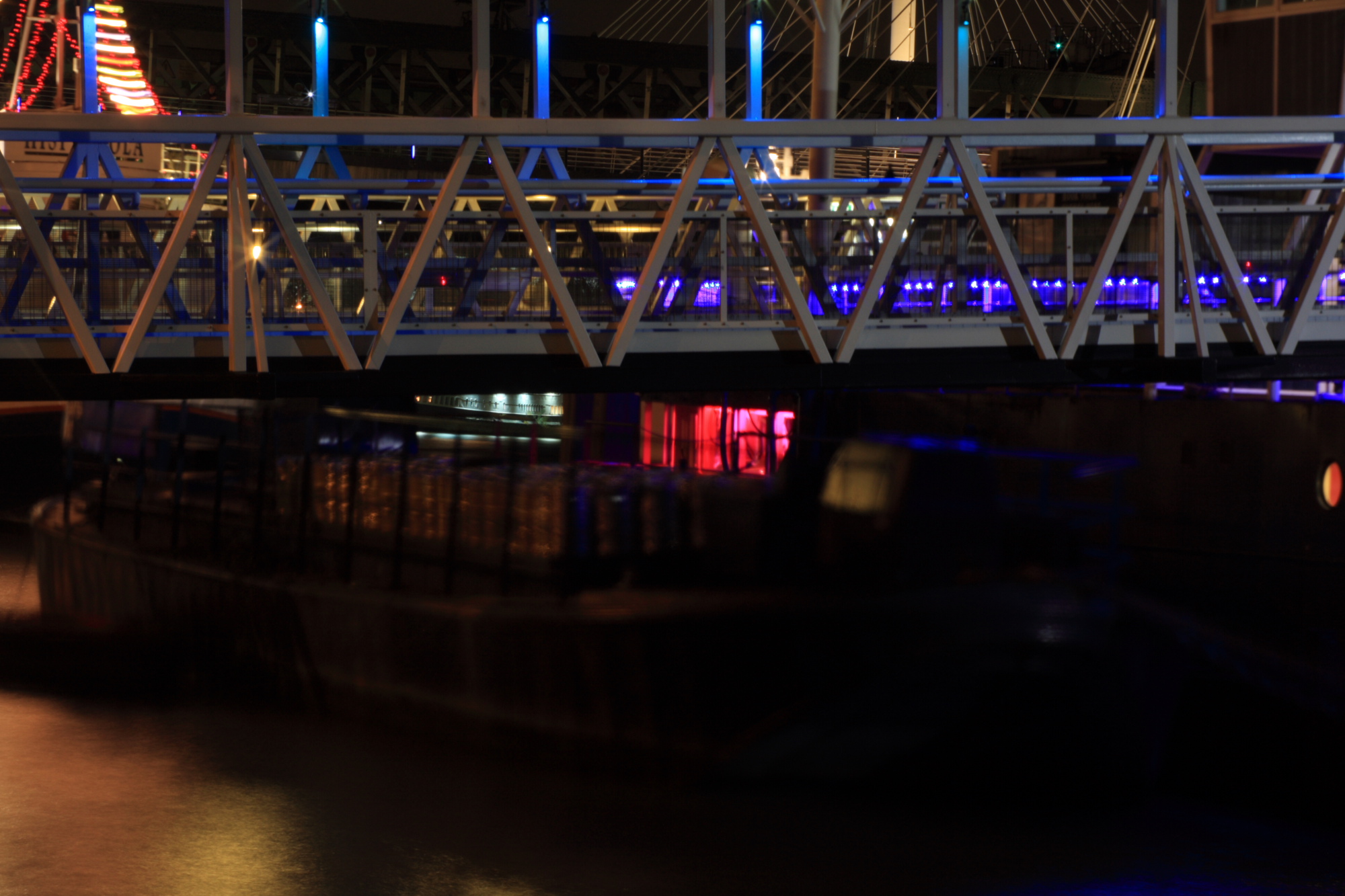 Coloured lights on boats at night.