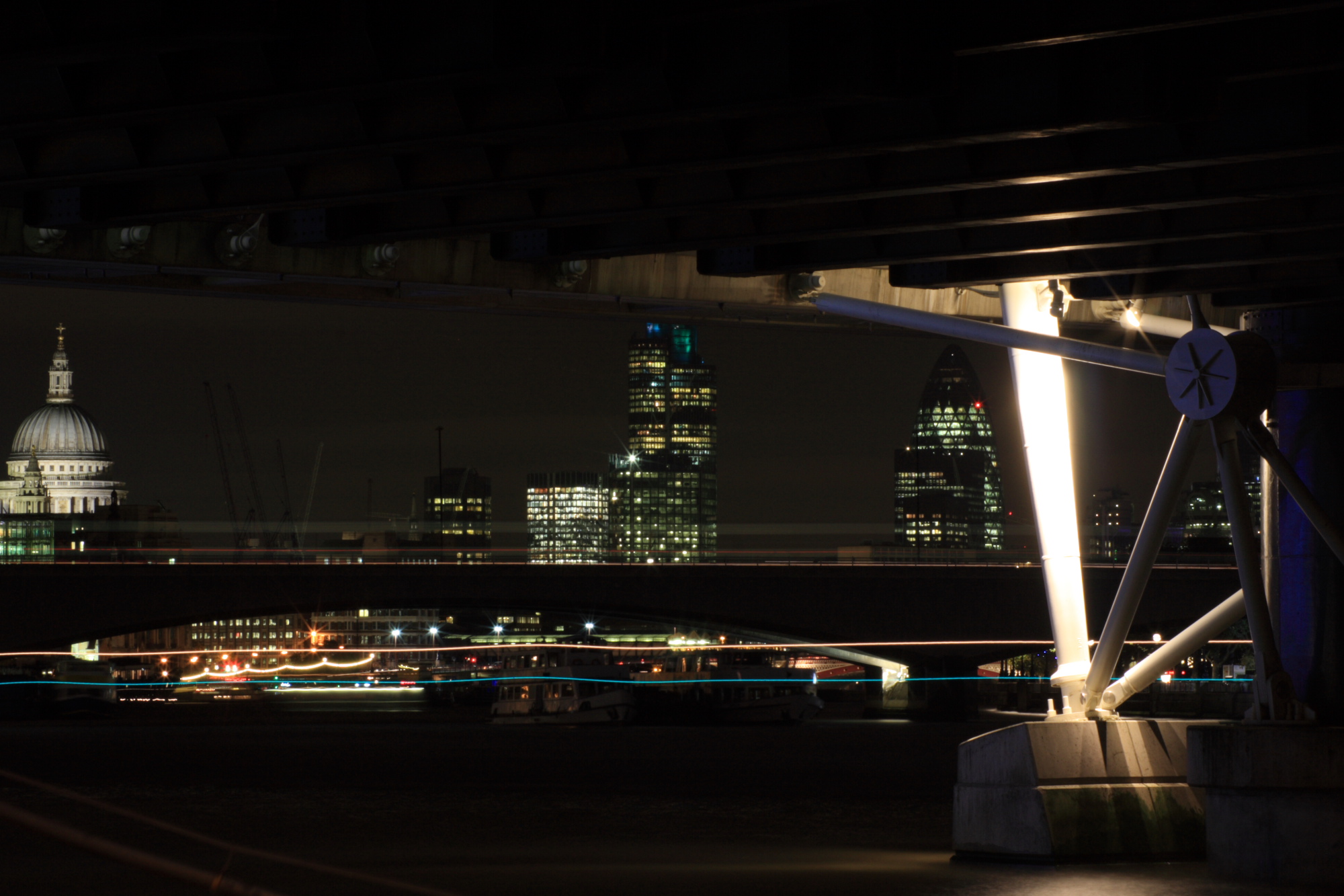 City of London at night from beneath Hungerford Bridge